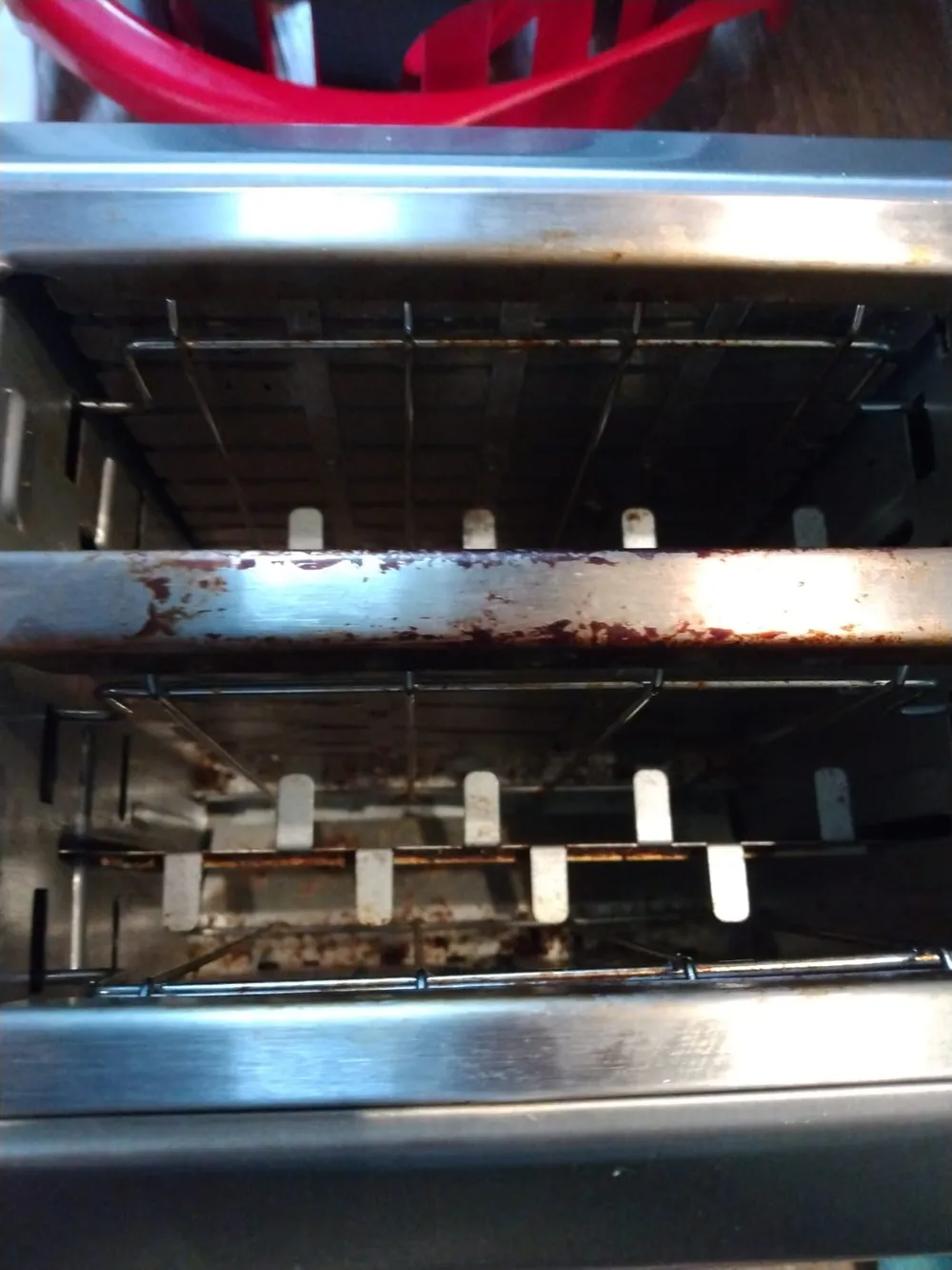 Dirty oven interior before professional cleaning — heavy buildup