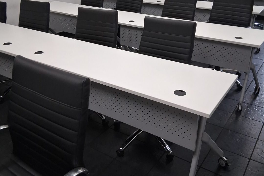 Training room after commercial cleaning Columbus workplace training room with rows of tables and chairs after cleaning
